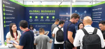 SZPulse booth at the Canton Fair with global buyers discussing verification and consulting services